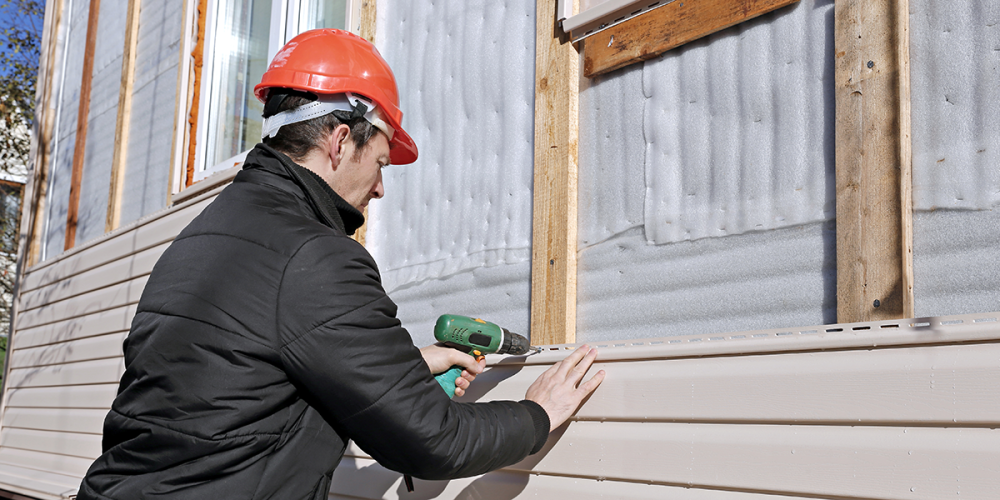 contractor installing new home siding