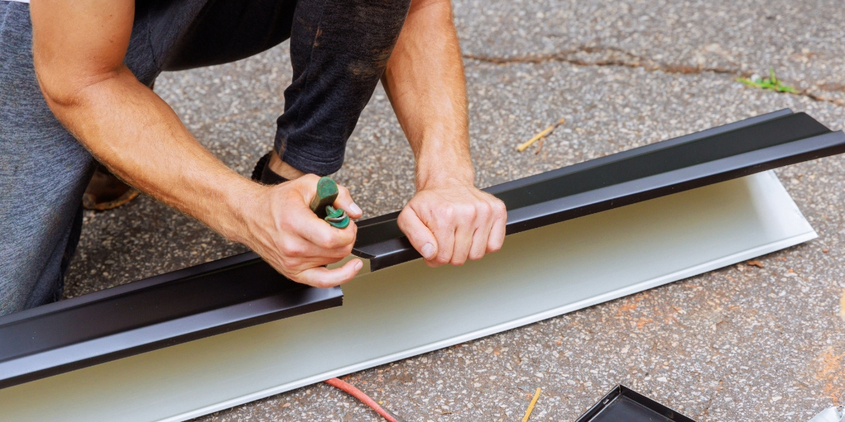 measuring and cutting gutters